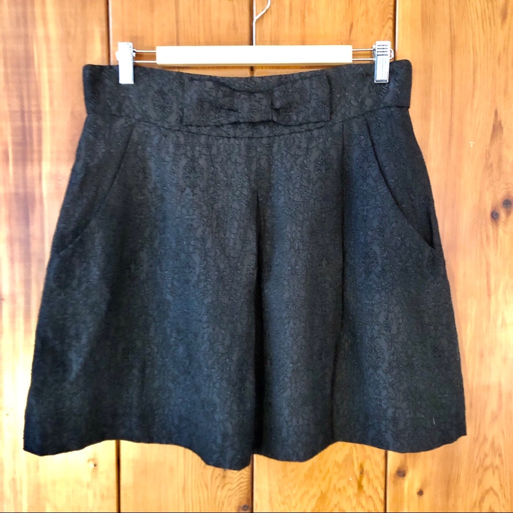 High-waisted, pleated mini skirt